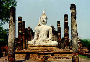Impressive temple ruins with Buddha images, historical park of Sukhothai (Old Sukhothai), Thailand.